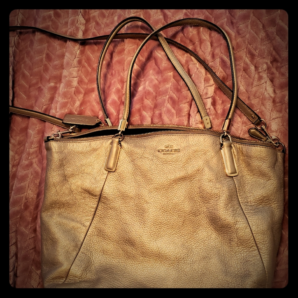 Gold coach bag